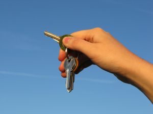 image of a hand and a key